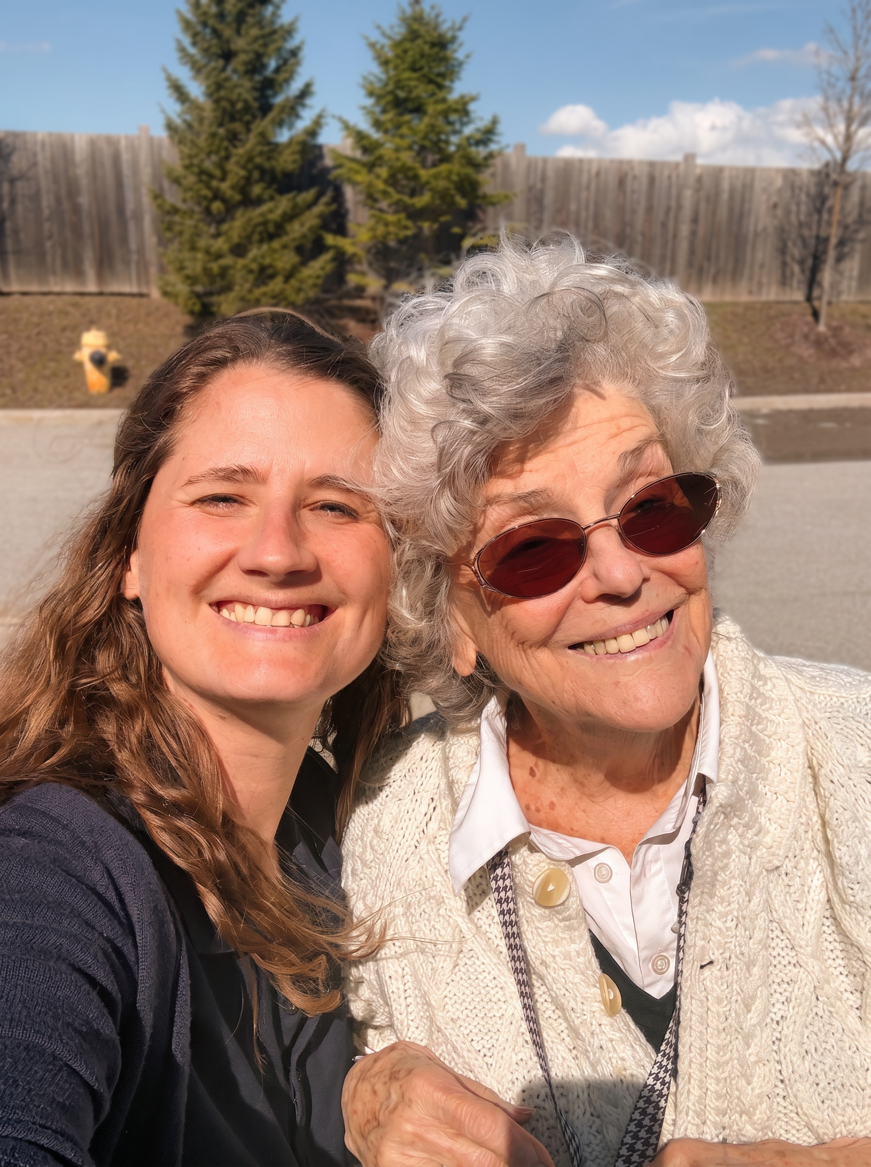 Aimee with a senior companion, smiling together outdoors